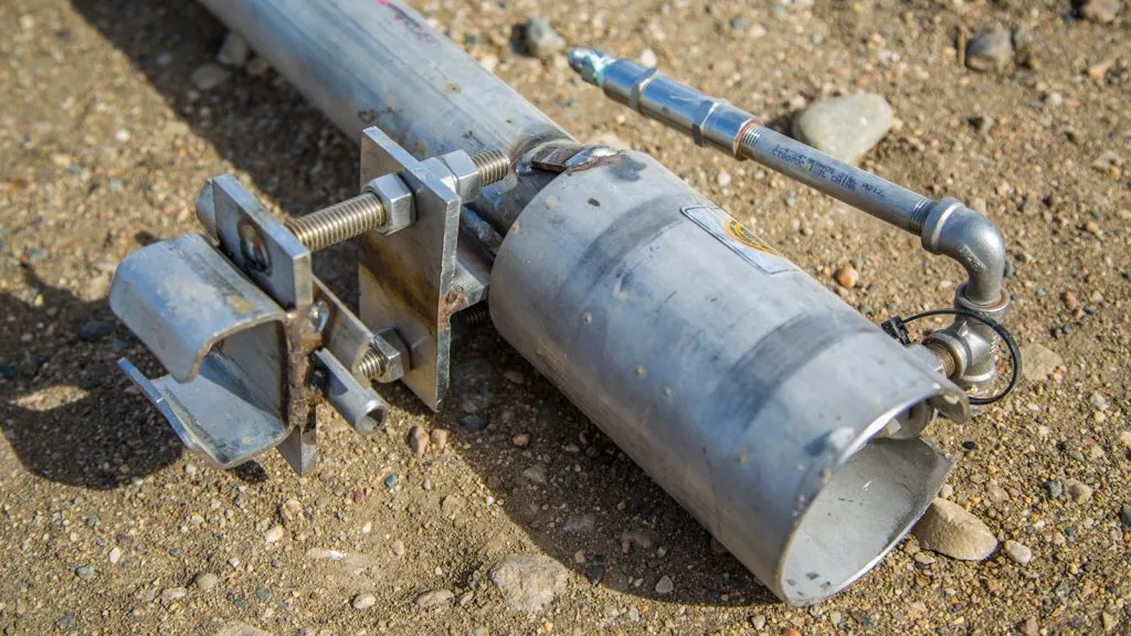 Close-up of a flare stack burner tip with attached pilot line and spark ignition assembly for rent in Alberta, SK, BC, Western Canada